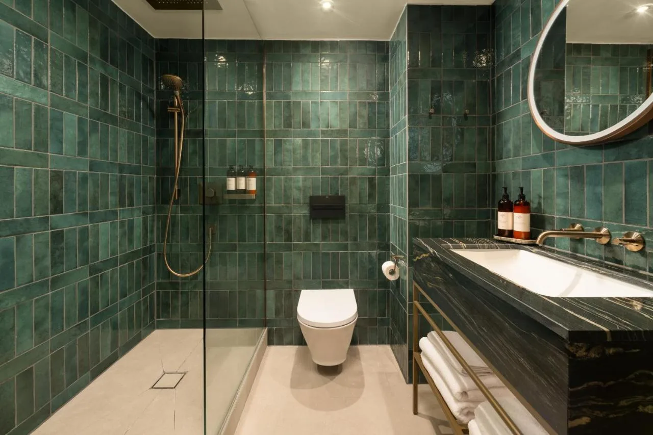 Green-tiled bathroom